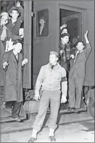  ?? (File Photo/AP) ?? Young Japanese, members of the first mass migration from Los Angeles for the war’s duration, wave goodbye in March 1942 from the steps of an Army train taking them to the reception center being built at Manzanar, Calif.