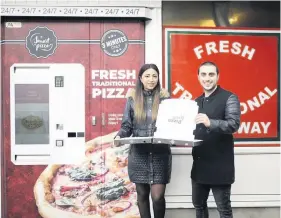  ??  ?? Sina Kiaei and Nooshin Zamaniyan at Pizza Bella in Bedminster which has launched Britain’s first pizza vending machine James Beck