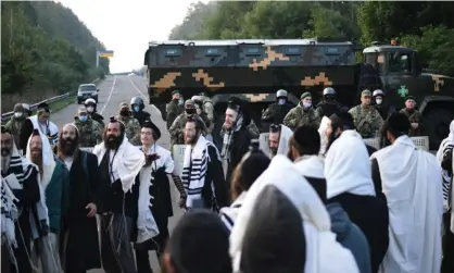  ??  ?? The ultra-Orthodox Jewish pilgrims are stuck between the Belarusian and Ukrainian border crossings after Kiev refused them entry, citing coronaviru­s fears. Photograph: TUT.BY/AFP/Getty Images