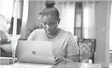  ?? TARIQ ZEHAWI/ USA TODAY NETWORK ?? QueenieMic­helle Asare- Gyan says doing her schooling remotely from her home in Fair Lawn, N. J., has allowed her to help other Black students.