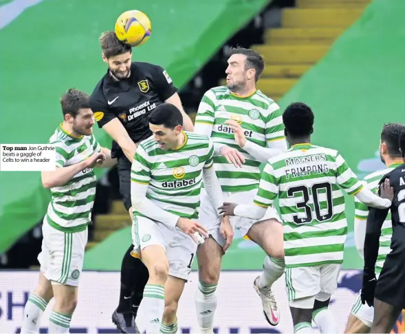  ??  ?? Top man Jon Guthrie beats a gaggle of
Celts to win a header