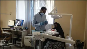  ?? MALIN FEZEHAI — THE NEW YORK TIMES ?? Dr. Abdulkadir Abdirahman Adan, the founder of Aamin Ambulance, is seen at his dental clinic in Mogadishu, Somalia, earlier this month.