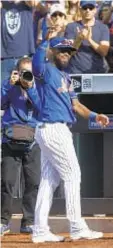  ??  ?? In last AB, Jose Reyes comes out of dugout to wave to crowd after grounding out in first