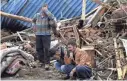  ?? IRNA/AP ?? Villagers weep for members of their family missing after flash floods hit Chenar village in northweste­rn Iran on Saturday. At least 30 people are believed to have died.