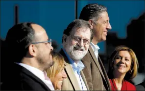  ?? AP/MANU FERNANDEZ ?? Spain’s Prime Minister Mariano Rajoy (center) attends a Catalan regional People’s Party meeting in Barcelona, Spain, on Sunday.