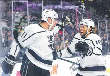  ?? ETHAN MILLER GETTY IMAGES ?? AFTER SCORING a power-play goal, Anze Kopitar (11) is greeted by Kings teammate Alex Iafallo. It was Kopitar’s second goal of the first period against the Vegas Golden Knights. Iafallo scored in the third period.