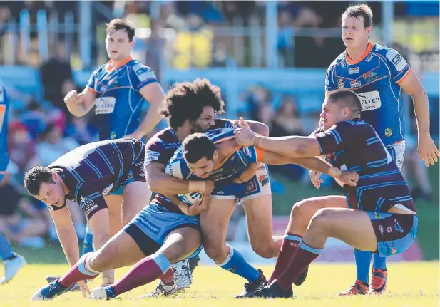  ?? Picture: JUSTIN BRIERTY ?? AGAINST SCRIPT: CQ Capras Luke George tackles Graham Clark during the match against Northern Pride at Stan Williams Park.