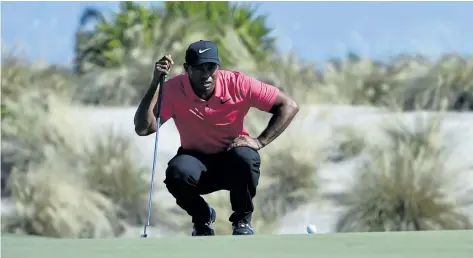  ?? DANTE CARRER/THE ASSOCIATED PRESS ?? Tiger Woods lines up a putt on second hole during the final round of the Hero World Challenge on Sunday at Albany Golf Club in Nassau, Bahamas.