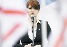  ??  ?? Maria Butina, leader of a pro-gun organizati­on in Russia, speaks at rally in support of legalizing the possession of handguns April 21, 2013, in Moscow, Russia,