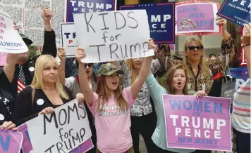  ?? — AFP ?? “Women for Trump” from New York, New Jersey and Connecticu­t show their support for Republican Presidenti­al nominee Donald Trump during a rally in front of Trump Tower on Thursday.