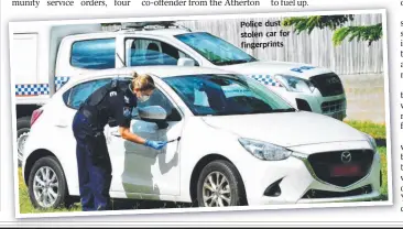  ??  ?? Police dust a stolen car for fingerprin­ts