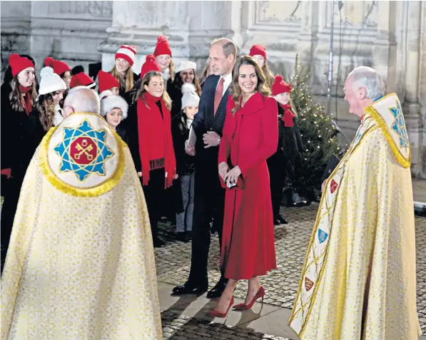  ?? ?? The Duke and Duchess of Cambridge meet the children they personally invited to the service, which will be aired on Dec 24