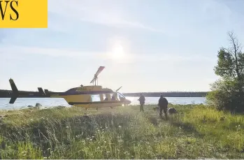  ?? MANITOBA RCMP/HANDOUT VIA REUTERS ?? RCMP officers continue their search near Gillam, Man., for Kam Mcleod and Bryer Schmegelsk­y, two fugitives wanted in the murders of three people in northern B.C. The search is new centred in remote York Landing, Man.