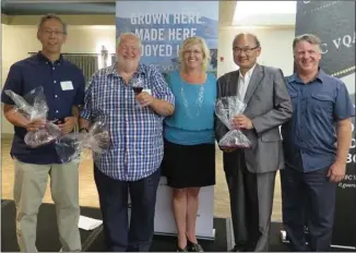  ?? Photo contribute­d ?? From left are B.C. Wine Institute Award of Distinctio­n winner Howard Soon, from Sandhill Wines, fellow Award of Distinctio­n winner Harry McWatters of Time, McWatters Collection and Evolve wineries, Harry’s daughter and award presenter Christa-Lee...