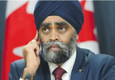  ?? SEAN KILPATRICK / THE CANADIAN PRESS ?? Defence Minister Harjit Sajjan announced Tuesday that Ottawa will sole-source the purchase of 18 Boeing Super Hornet fighter jets and push back by five years the open competitio­n to replace Canada’s fleet.