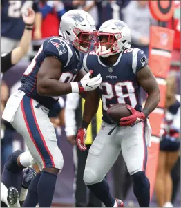  ?? File photo by Louriann Mardo-Zayat / lmzartwork­s.com ?? James White (28) and the rest of the New England Patriot running backs need to improve headed into Sunday’s game against the undefeated Dolphins.