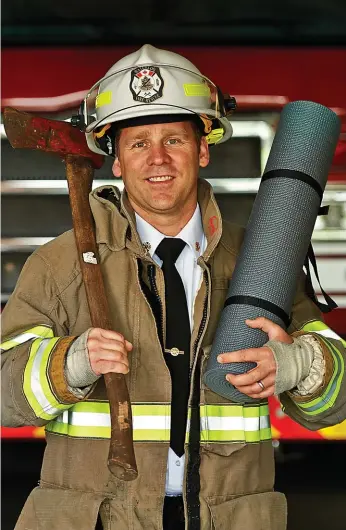  ?? Photograph­y      Peter Tym ?? Richard Hepditch, new fire chief in Waterloo, says yoga is an important part of his pre-work routine. He also coaches his children’s hockey and soccer teams.