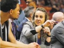  ?? Michael Reaves / Getty Images 2020 ?? Spurs assistant Becky Hammon, coaching Bryn Forbes in a 2020 game, has been with the team for the past seven seasons.