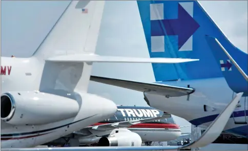  ??  ?? Trump and Clinton’s planes are seen at Ronald Reagan Washington National Airport in Arlington, Virginia. — AFP photo