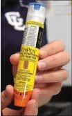  ??  ?? RN Danita Breeden, the nurse at Chickamaug­a Elementary, with an EpiPen. Neither Walkre County nore Chickamaug­a schools stock EpiPens. Instead, students provide their own. (Messenger photos/Mike O’Neal)