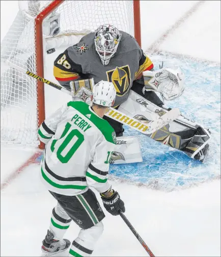  ?? Jason Franson The Associated Press ?? Knights goaltender Robin Lehner makes one of his 24 saves in Game 2 as he extends his postseason shutout streak to 131:44.