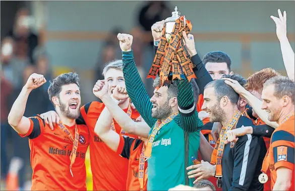  ?? Pictures: SNS ?? CAM BEFORE THE STORM: Dundee United captain Cammy Bell leads the celebratio­ns at Fir Park as the Tannadice side sealed the Irn-Bru Cup.