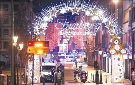  ?? FREDERICK FLORIN/AFP ?? Police motorcycle­s drives in the streets of Strasbourg, eastern France, after a shooting breakout, on Tuesday.