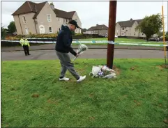  ??  ?? Floral tributes were left at the scene, above, and below DS Jim Smith is part of the police investigat­ion