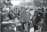  ?? KEVIN HAGEN/AP PHOTO ?? New York City Mayor Bill de Blasio greets spectators at the Caribbean Carnival on Monday in Brooklyn. The parade, one of the largest celebratio­ns of Caribbean culture in the U.S., was held amid ramped-up security.