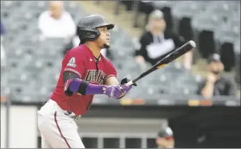  ?? AP PHOTO/CHARLES REX ARBOGAST ?? Arizona Diamondbac­ks’ Ketel Marte watches his RBI sacrifice fly off Chicago White Sox starting pitcher Touki Toussaint during the third inning of a baseball game on Thursday in Chicago.