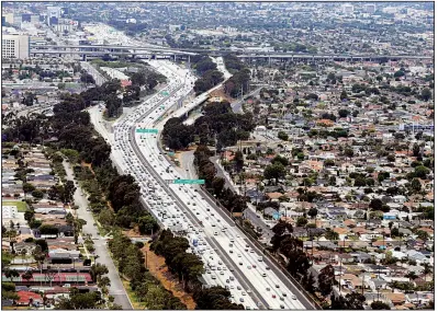  ?? AP ?? President Donald Trump’s administra­tion on Thursday revoked California’s authority to limit greenhouse gas emissions caused from motor vehicles such as these passing near Los Angeles Internatio­nal Airport on the San Diego Freeway in 2017.