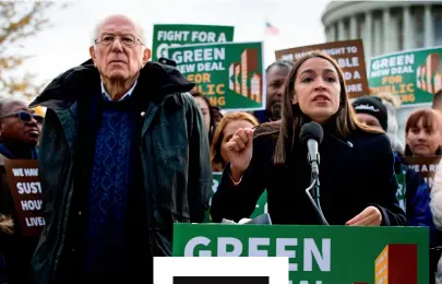  ??  ?? Ocasio-Cortez with Sanders last year, introducin­g a bill to reduce carbon emissions in public housing