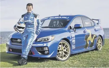  ??  ?? 0 Mark with his Isle of Man lap record-setting Subaru Impreza