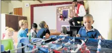  ?? Picture: FREDLIN ADRIAAN ?? SKIPPING CLASS: Milani Nkosi, 4, plays foosball while the rest of the gang watch the Safety First puppet show at Petite Boss in Stanley Street