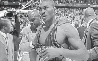  ?? USA TODAY ?? Ron Artest leaves the floor after a melee involving fans during an infamous game against the Pistons on Nov. 19, 2004, at the Palace of Auburn Hills.