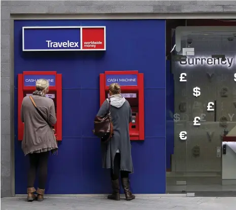  ?? Bloomberg ?? A Travelex currency exchange in London. Far from vanishing, the amount of cash in the world is increasing