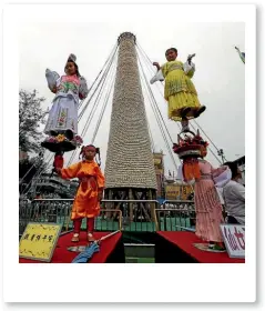  ?? PHOTO: REUTERS ?? A tower made from buns at the famous Cheung Chau Bun Festival.