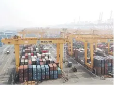  ??  ?? This general view shows a container terminal of South Korea’s Hanjin Shipping in the southeaste­rn port city of Busan. The axe finally fell on South Korea’s once-mighty Hanjin Shipping on February 17 as a Seoul court declared it bankrupt after...