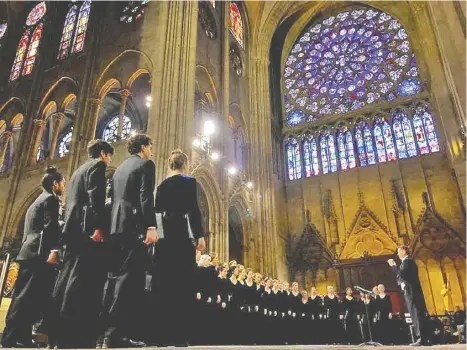  ?? COURTESY PHOTO ?? The Santa Monica Choir performs at the Notre Dame Cathedral three days before tragedy struck the world's medieval treasure.