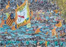  ?? Picture: GETTY IMAGES ?? People hold up Catalan independen­ce flags during a march on the streets of Barcelona, the massive protest attracting a whopping 450,000 people.