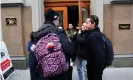  ??  ?? Laid-off WeWork employees gather on sidewalk outside WeWork corporate headquarte­rs in Manhattan, New York. Photograph: Mike Segar/Reuters