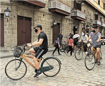  ?? PHOTOGRAPH BY BOB DUNGO JR. FOR THE DAILY TRIBUNE @tribunephl_bob ?? CLOSED for most part of the lockdowns, Intramuros opened its doors to the public this month, allowing local and foreign tourists to enjoy riding their bikes on a weekend.