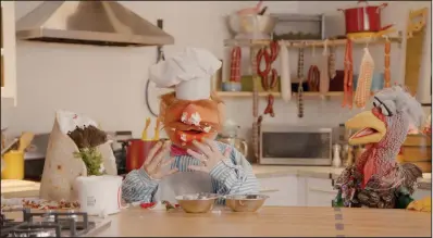  ??  ?? Swedish Chef and Beverly Plume serve up a satire of online cooking shows in “Muppets Now.”