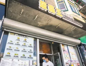  ??  ?? The 6yearold Cantonese bakery lists the many bun possibilit­ies on an official pineapple bun family tree displayed in the window.