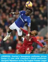  ??  ?? LIVERPOOL: Everton’s Senegalese midfielder Idrissa Gueye (L) vies with Liverpool’s Dutch midfielder Georginio Wijnaldum during the English Premier League football match between Liverpool and Everton at Anfield in Liverpool, north west England yesterday. — AFP