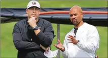  ?? PHOTOS BY CURTIS COMPTON/AJC 2021 ?? Falcons head coach Arthur Smith (left) and general manager Terry Fontenot, seen in June, shared the news about roster cuts Tuesday with most of the players.