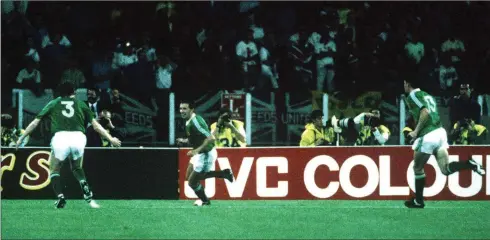  ??  ?? Kevin Sheedy (centre) celebrates after scoring against England in the drawn World Cup opener 30 years ago.