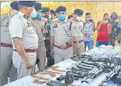  ?? HT PHOTO ?? DGP Dilbag Singh and other police officials with the recovered arms and ammunition in Rajouri on Saturday.