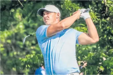  ?? EPA ?? Brooks Koepka hits his second shot on the 11th hole during the third round.