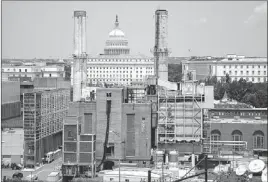  ?? CAROLYN KASTER/ THE ASSOCIATED PRESS ?? The Capitol’s dome is seen Monday behind the Capitol Power Plant in Washington, D.C. The plant provides power to buildings in the Capitol Complex.